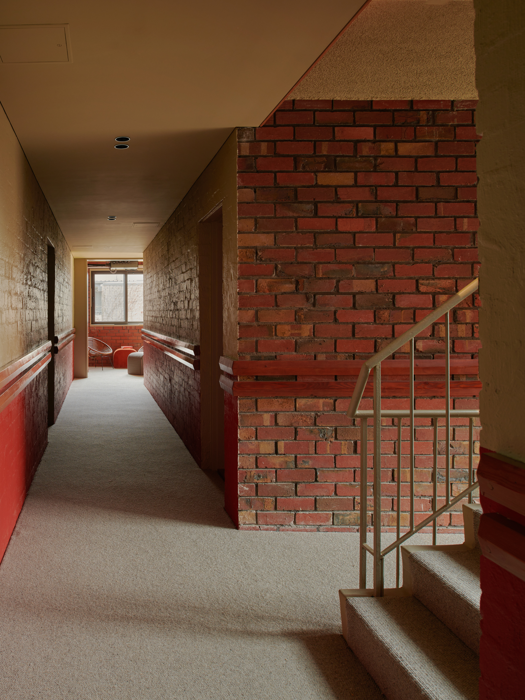 A hallway with brick walls