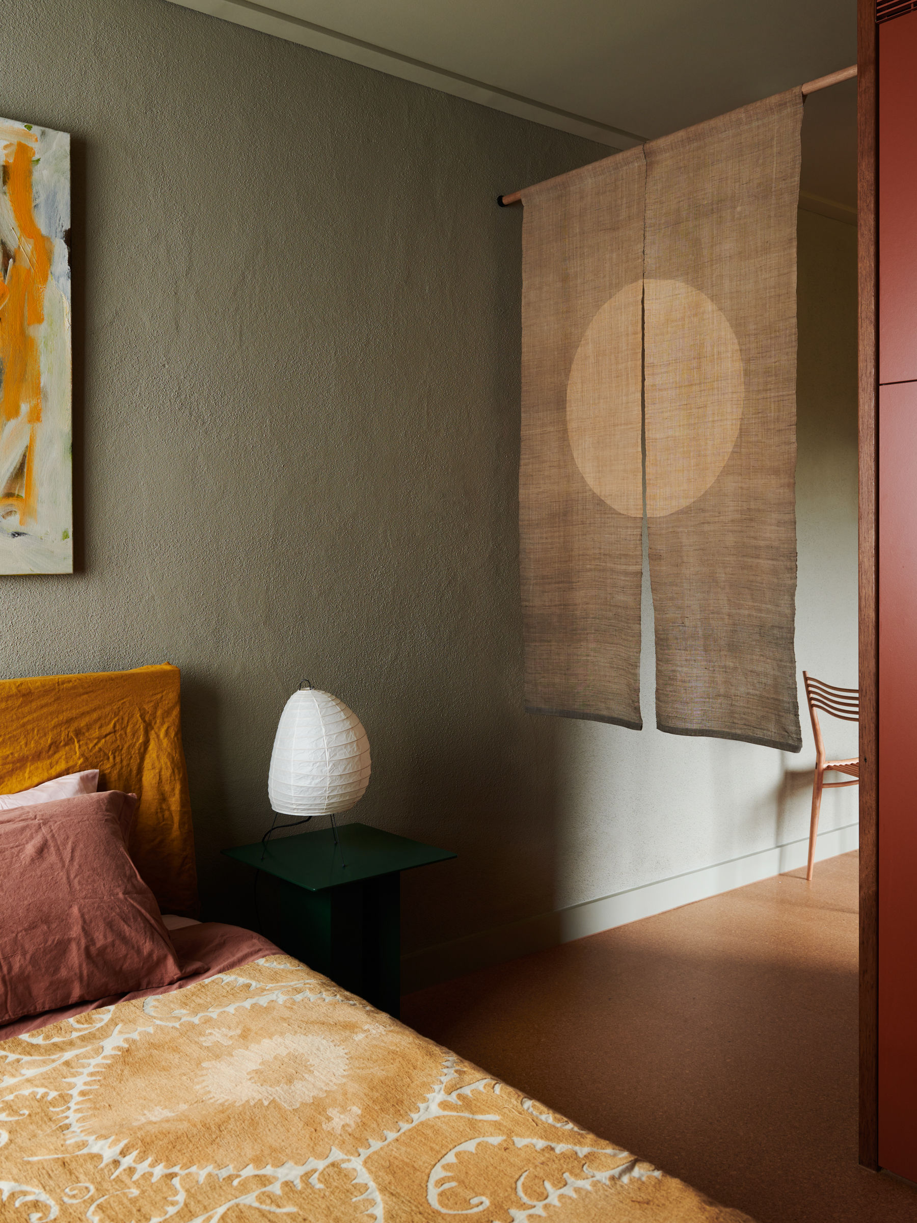 A bed, bedside table and lamp.